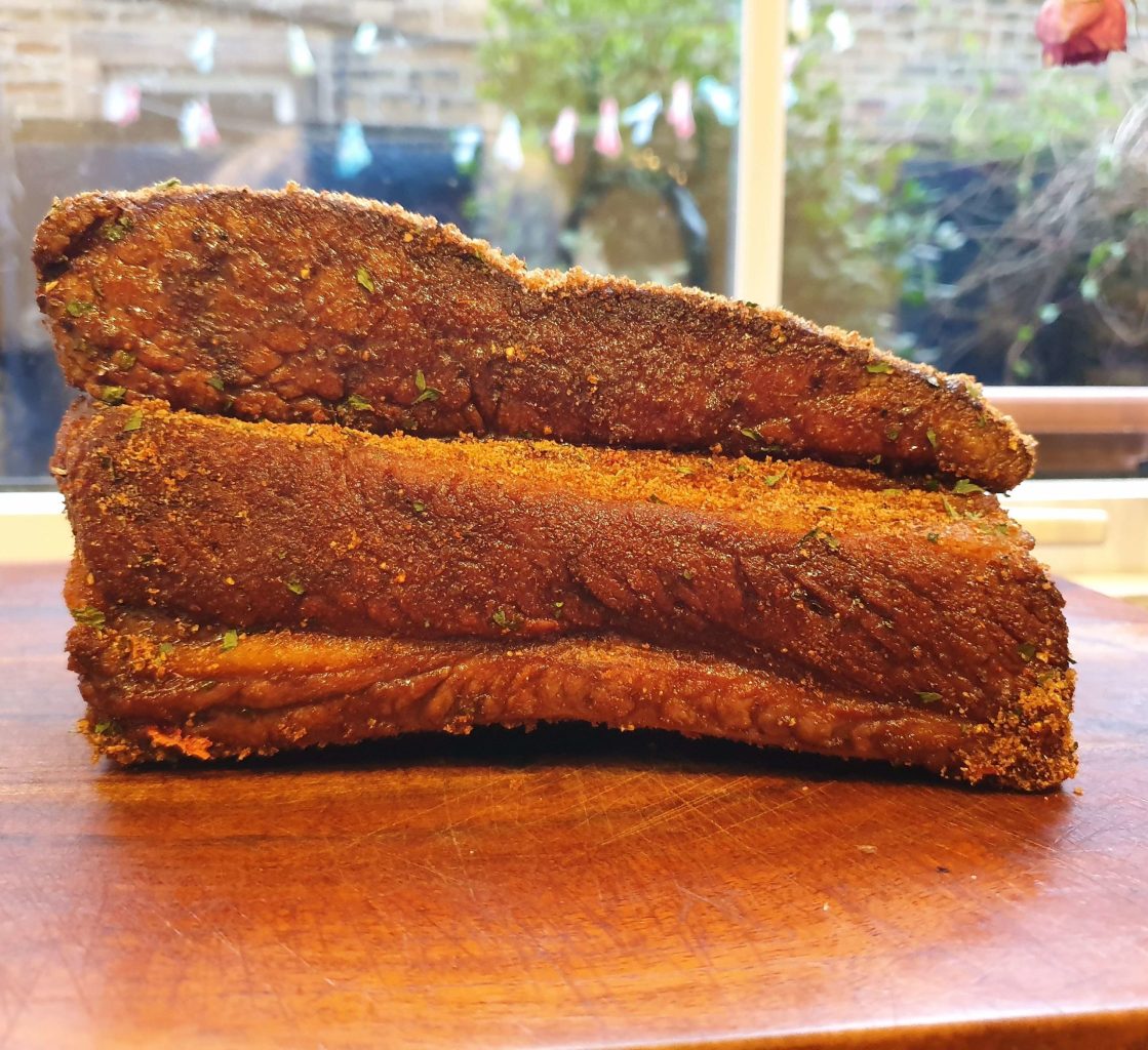 a piece of cake sitting on top of a cutting board
