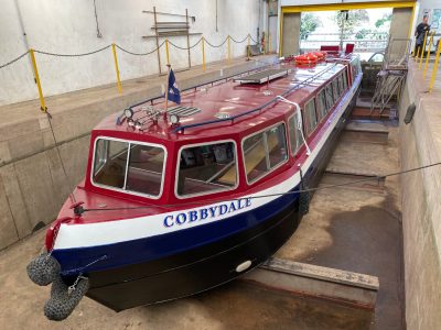 a boat parked on the side of a building