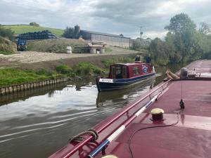 a group of people walking across a bridge over a body of water