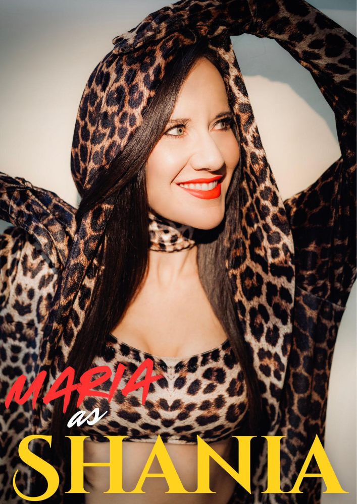 Smiling woman in leopard print hood and top with text 'MARIA as SHANIA'.